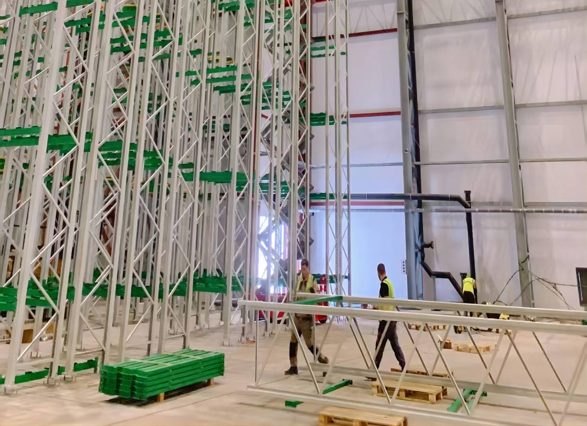 รายงานสถานที่ก่อสร้างโกดังเบียร์ Stacker Crane ของเรา